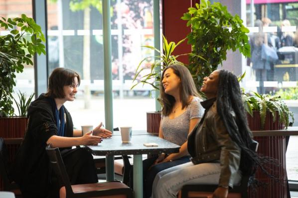 three female students chatting